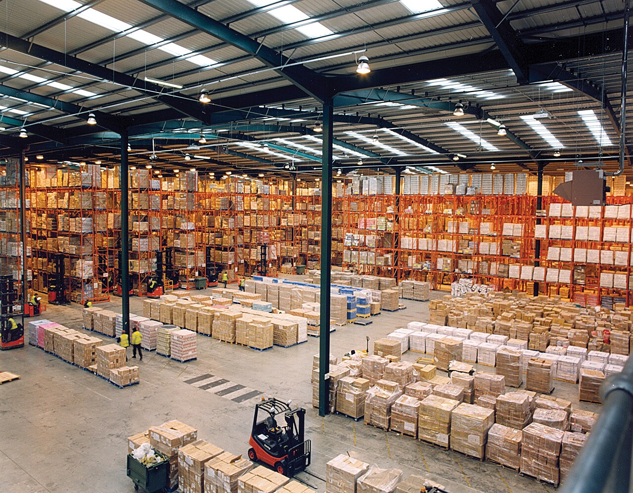 Warehouse with pallet racking and a forklift